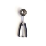 Oxo Good Grips Medium Cookie Scooper over a white background.