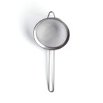 A small stainless steel fine mesh strainer over a white background.