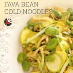 Taiwanese cold noodles made with slices of summer squash, fava beans, cucumber, and dressed with tahini turmeric dressing over a white plate with a yellow background. Text lay-over reading "SUMMER SQUASH FAVA BEAN COLD NOODLES thesoundofcooking.com"
