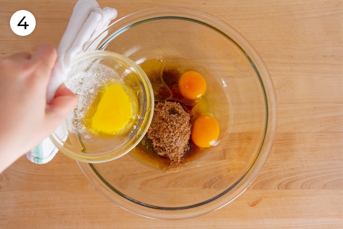 Cindy pouring melted butter into the large mixing bowl with light brown sugar, sugar, vanilla extract, and two eggs, labeled with a circled number "4."