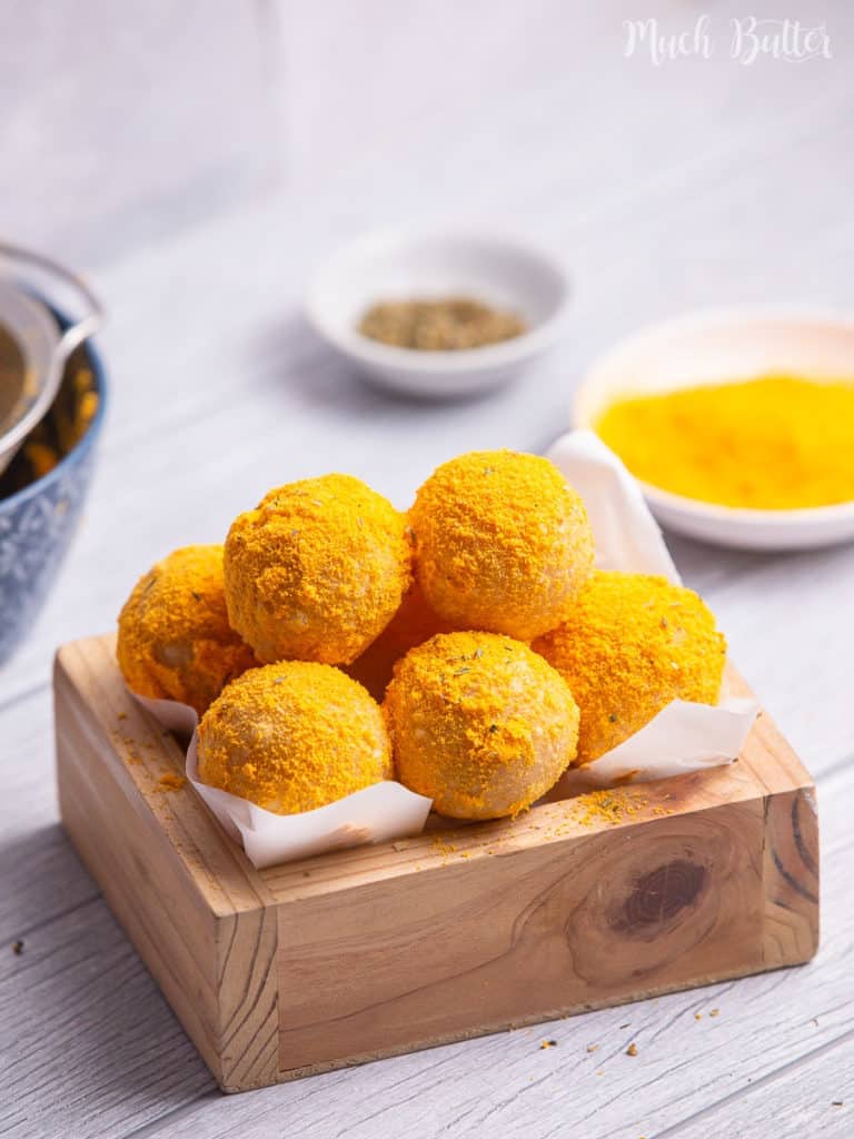 Korean mozzarella cheese balls in a wood serving box lined with parchment.