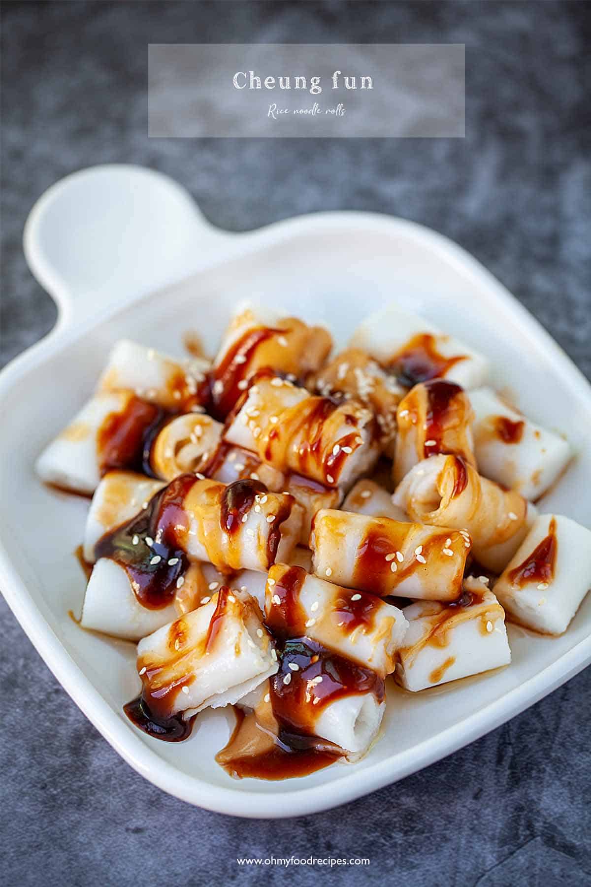 Rice noodle rolls with sauce on a white plate.