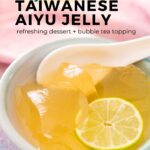 Scoops of aiyu in a blue bowl with a white porcelain spoon, topped with lime juice, honey, and a thin slice of lime with text, "easy Taiwanese aiyu jelly – refreshing dessert and bubble tea topping" and "the sound of cooking dot com" with a watermelon logo.