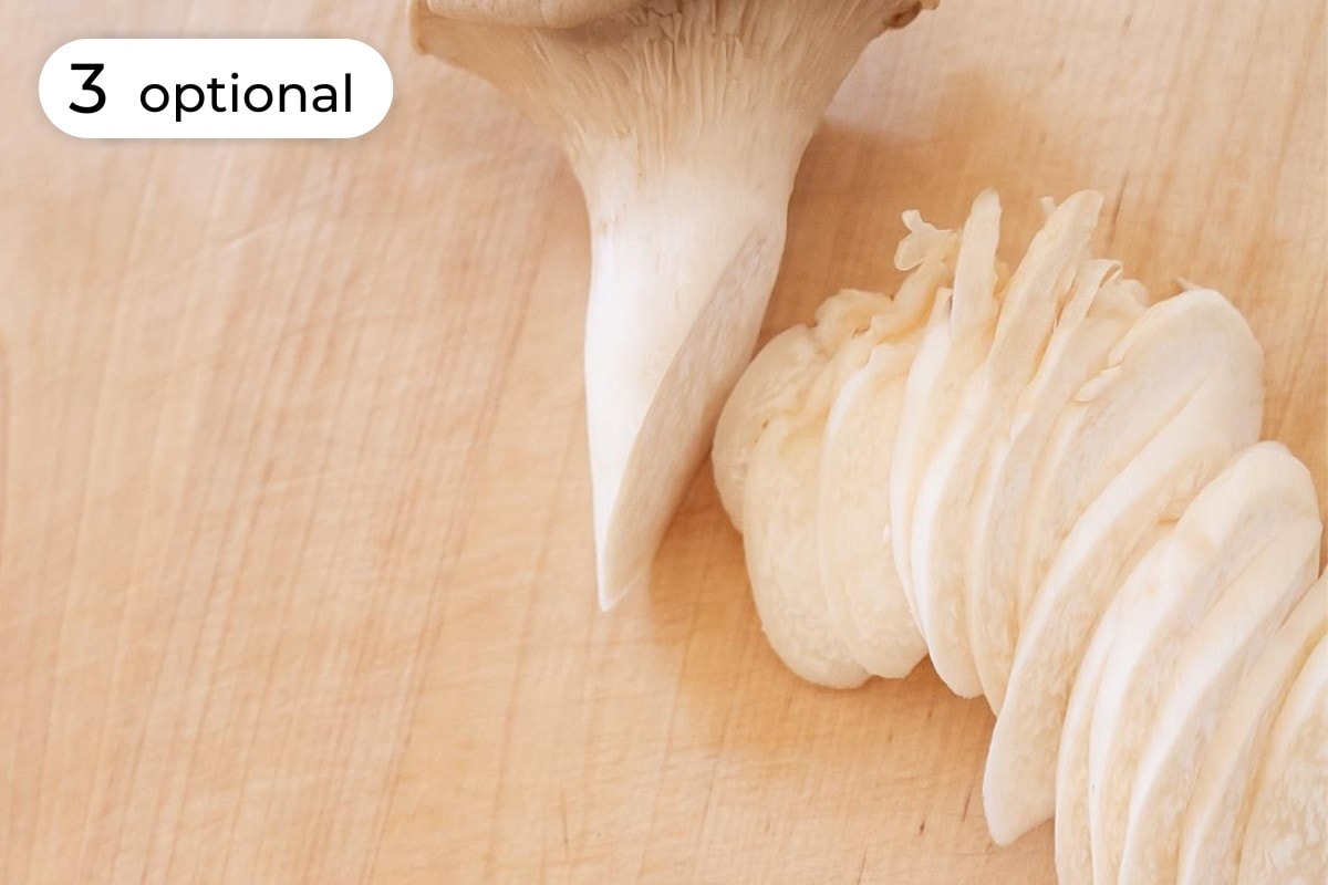 Recipe step 3 - optional: A king trumpet mushroom thinly sliced at an angle.