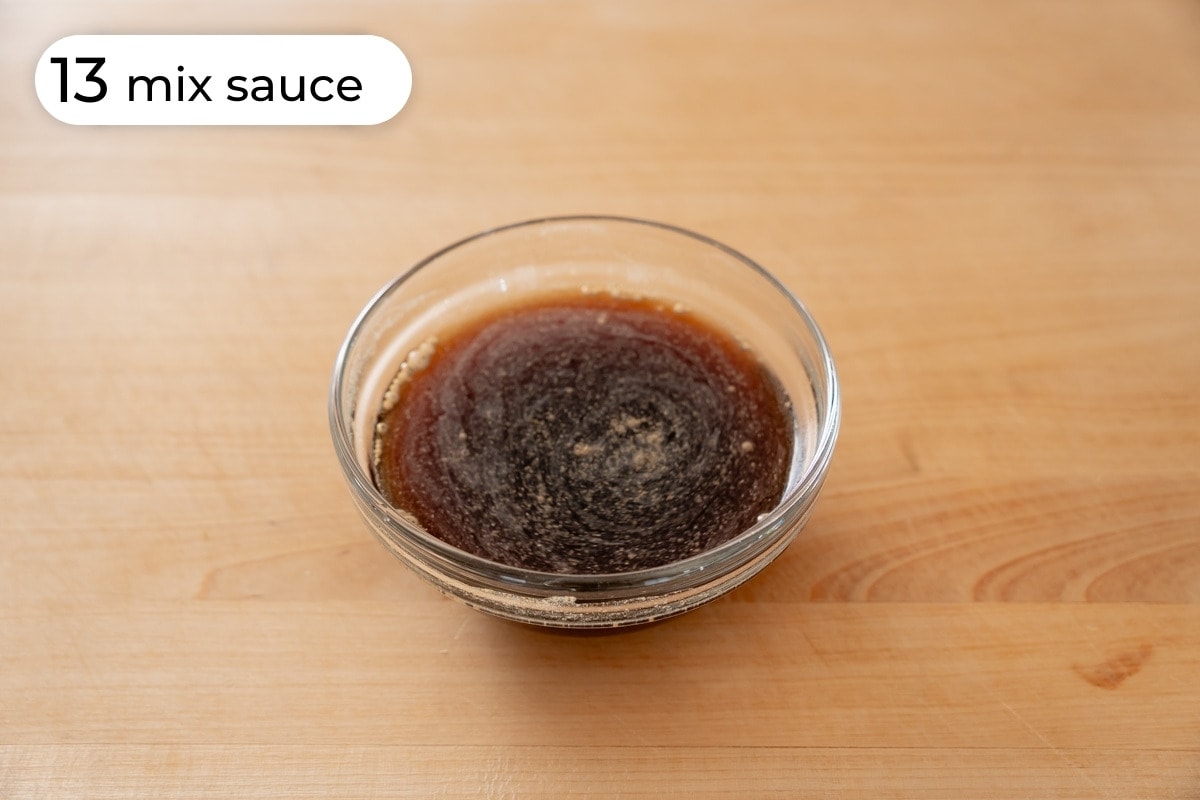 Recipe step 13 - mix sauce: The sauce ingredients mixed in a small bowl on a wood.