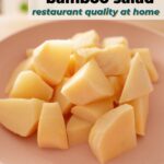 Plate of sliced bamboo shoots on a pink dish, with overlay text that reads "Crunchy Sweet Taiwanese Bamboo Salad – restaurant quality at home."
